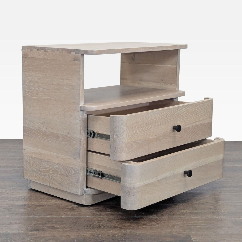 2. Angled view of light wood end table showing two drawers partially open and an open shelf above them.