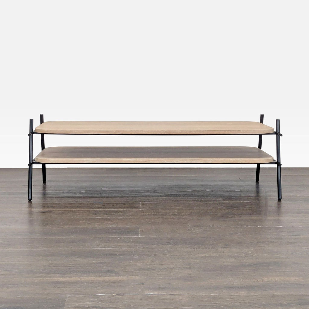 1. Modern coffee table with double wood shelves and black metal frame, viewed from the front on wood floor.