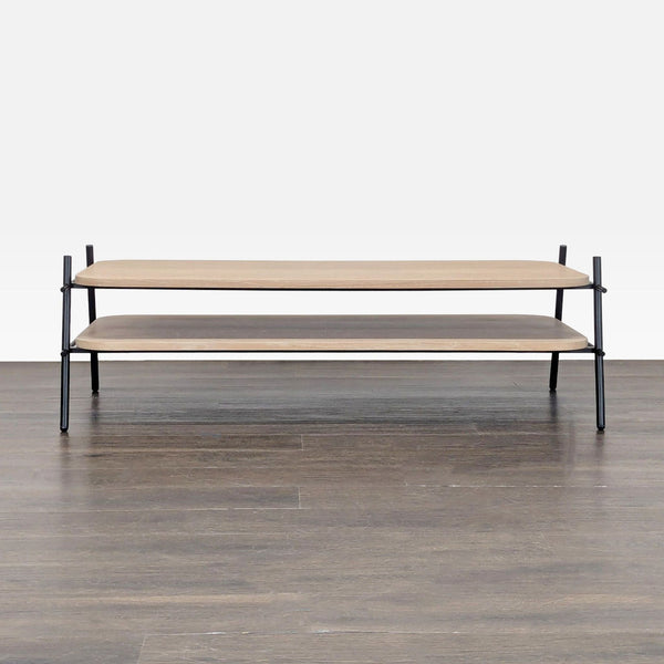 1. Modern coffee table with double wood shelves and black metal frame, viewed from the front on wood floor.