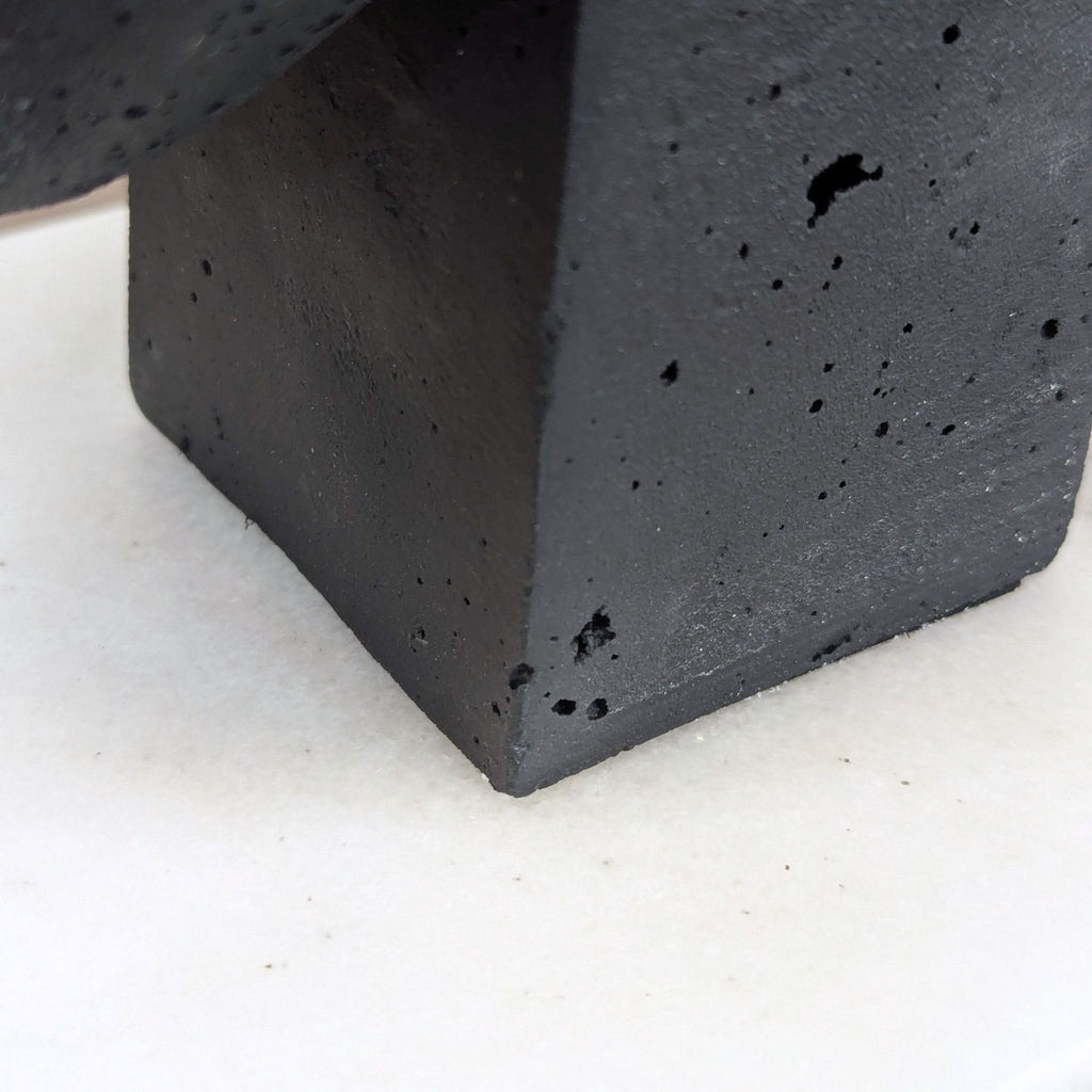 Contemporary Arteriors Home face sculpture with clean lines, resting on white marble, perfect for shelves.