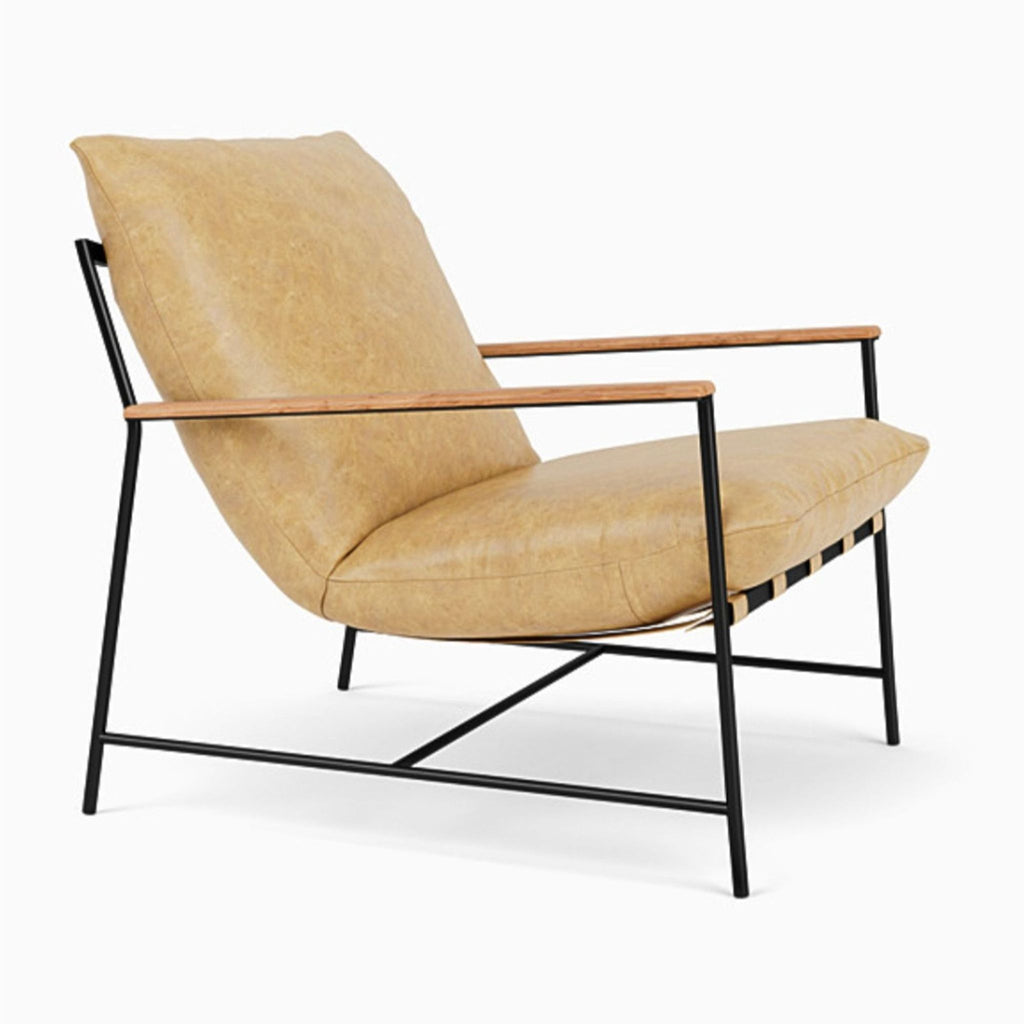 Side angle of Denver Modern lounge chair showing soft tan leather, black metal frame, and sleek wooden arms; modern style.