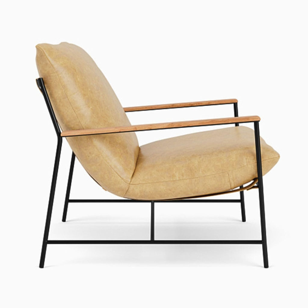 Profile view of Denver Modern lounge chair with plush tan leather, sturdy black frame, and slim wood armrests; for any lounge.