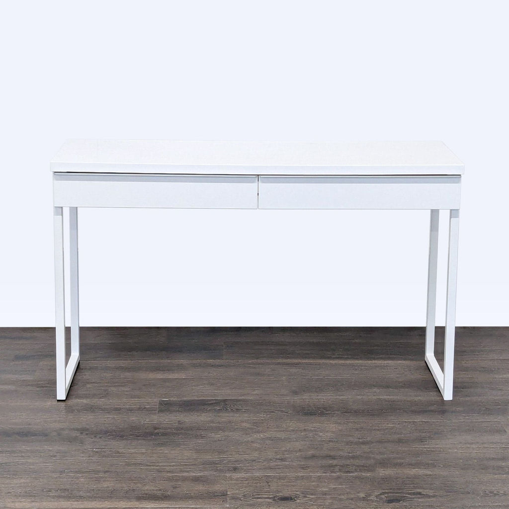 1. White IKEA desk with minimalist design, two drawers, and sturdy metal legs, perfect for various workspace styles.  