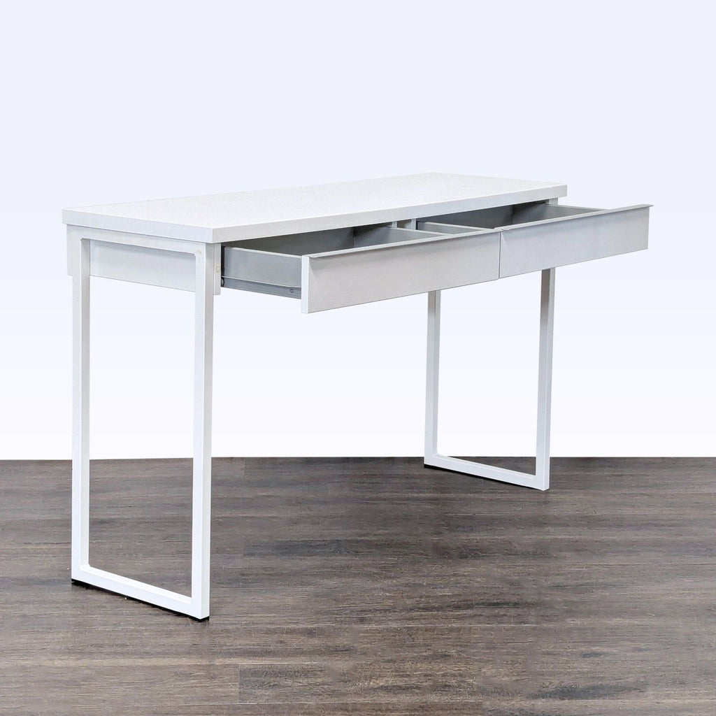 2. Modern IKEA desk in white, featuring two spacious drawers and slim metal legs, ideal for home office organization.  