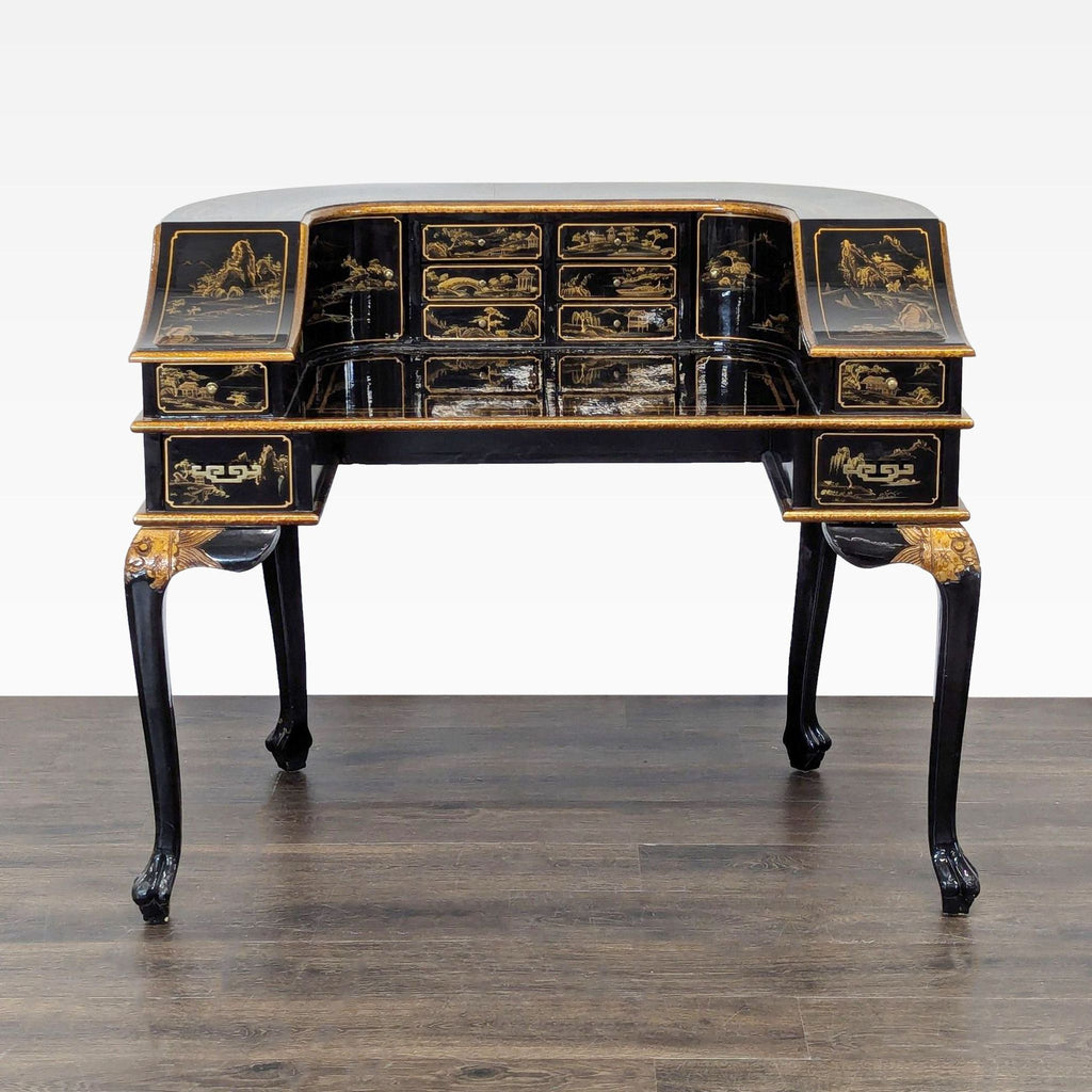 2. Glossy black desk featuring intricate gold artwork, numerous small drawers, and a unique curved design with carved legs.
