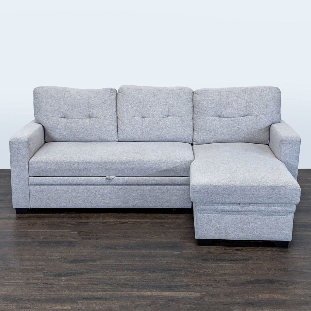 Light gray sectional sofa with pull-out bed and storage chaise, designed for comfort and space-saving convenience.