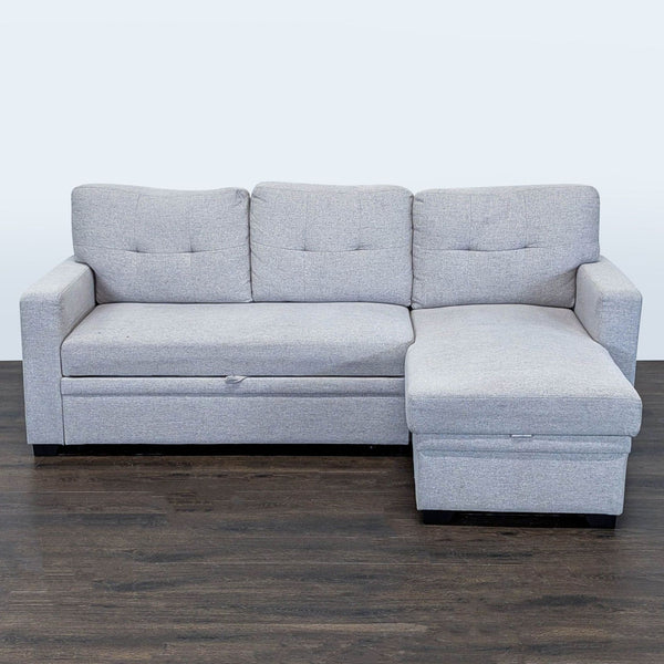 Light gray sectional sofa with pull-out bed and storage chaise, designed for comfort and space-saving convenience.