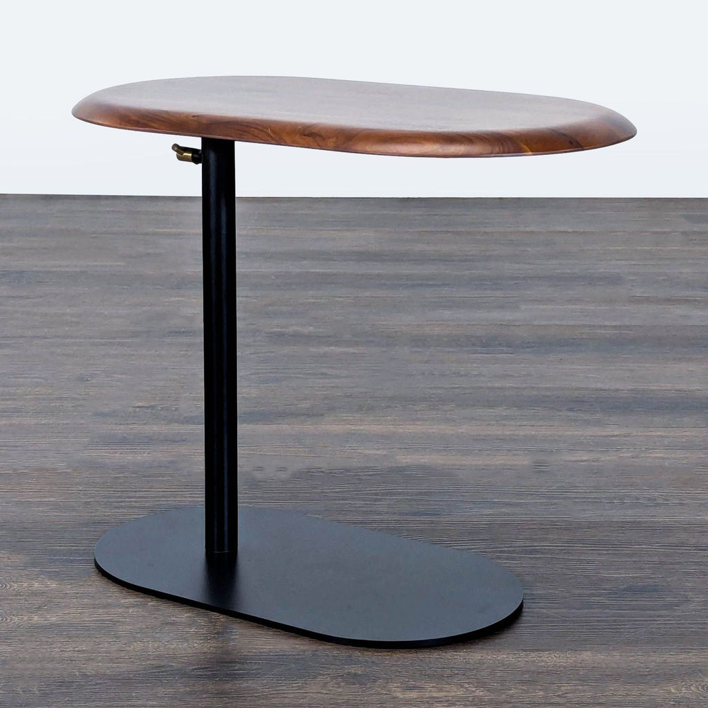 Adjustable height side table with wooden top and black steel base, by Article.