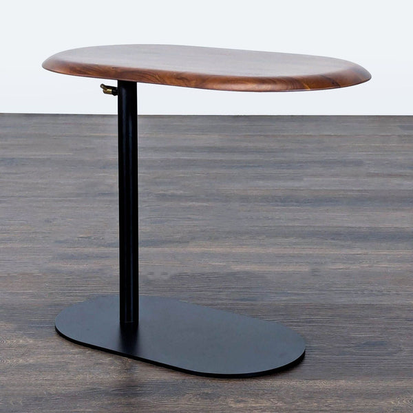 Adjustable height side table with wooden top and black steel base, by Article.