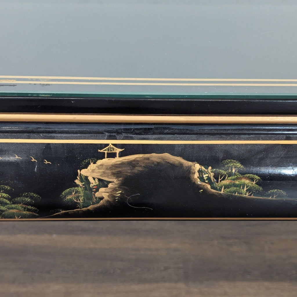 Custom console table with scenic artwork, gold-trim apron, glass top, and ornate paw-footed legs.