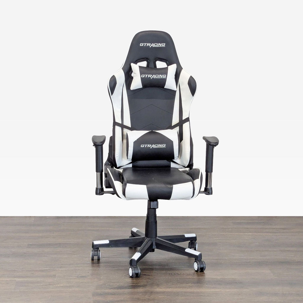 Sleek black and white GTRacing gaming chair with ergonomic design and adjustable armrests, shown in great condition.  