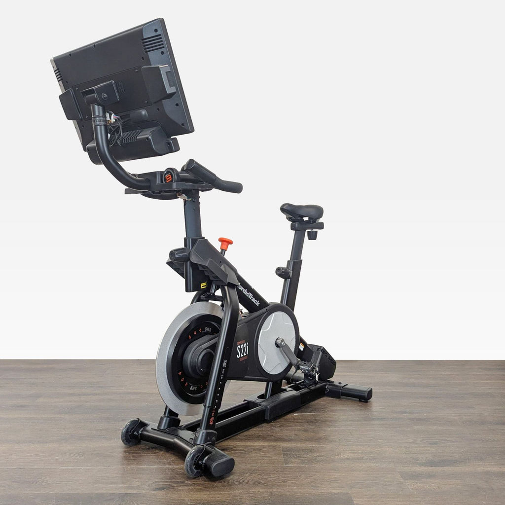 Side view of the NordicTrak S22i exercise bike, featuring sturdy frame and touchscreen.  
