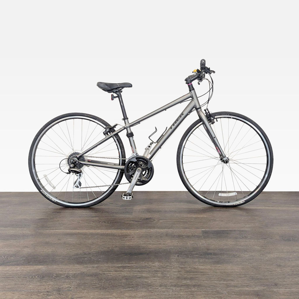 A Trek hybrid bike with an aluminum frame and 24-speed Shimano gearing, ideal for commuting or fitness rides.