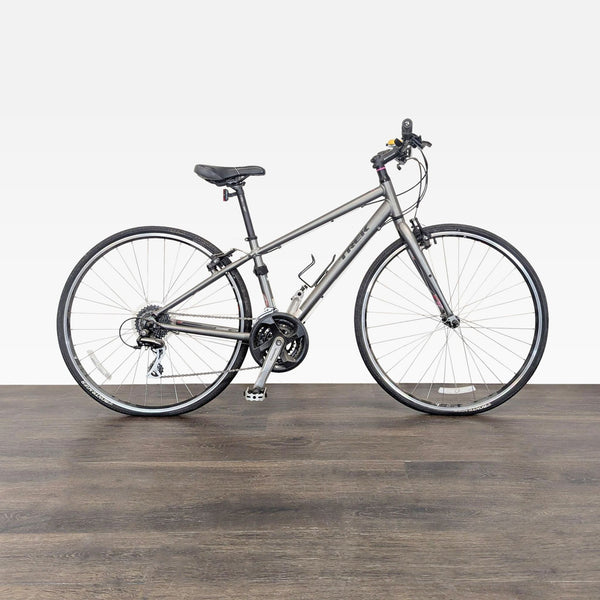 A Trek hybrid bike with an aluminum frame and 24-speed Shimano gearing, ideal for commuting or fitness rides.