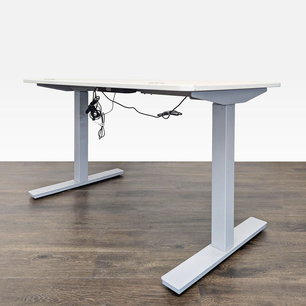 Adjustable standing desk from Autonomous featuring a sleek design, electric controls, and sturdy build for office or home.