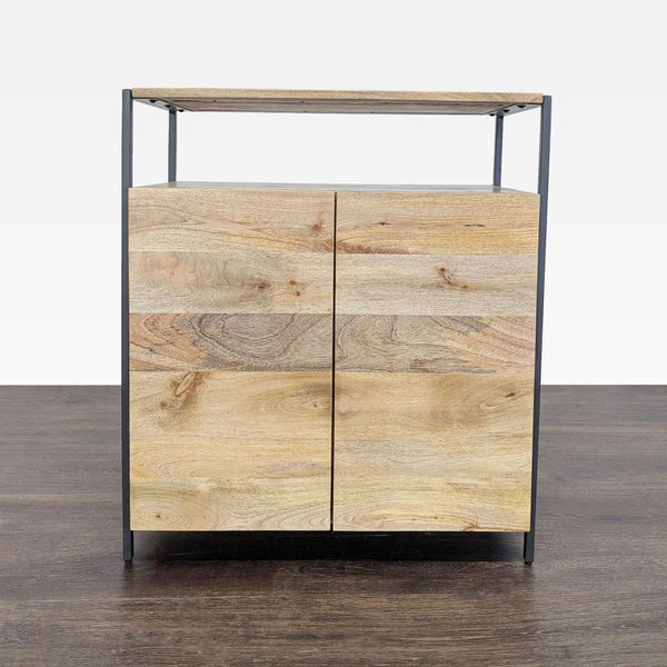 Mango wood cabinet with two doors, adjustable shelf, and blackened steel frame by West Elm.