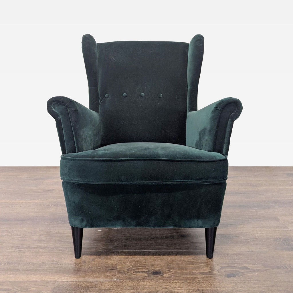 Stylish dark green velvet armchair and footstool set from Ikea, ideal for a modern lounge or reading nook.
