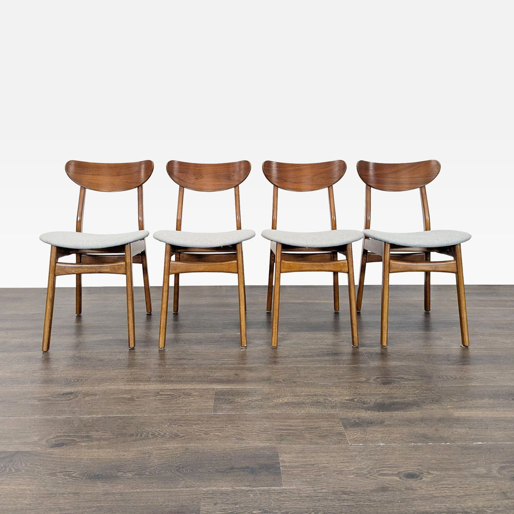 1. Set of four West Elm dining chairs, wood frames with curved backs and light fabric seats, on wood floor.