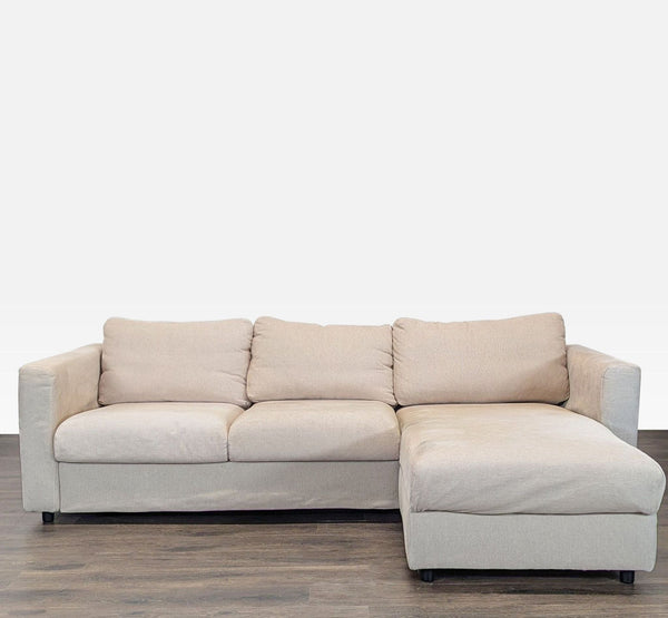 Beige L-shaped IKEA sectional with right-hand chaise, plush cushions, and modern lines, ideal for living rooms.