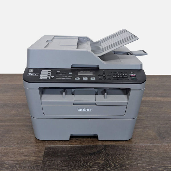 Brother all-in-one printer with scanner and copier, compact design, suitable for home or office use.