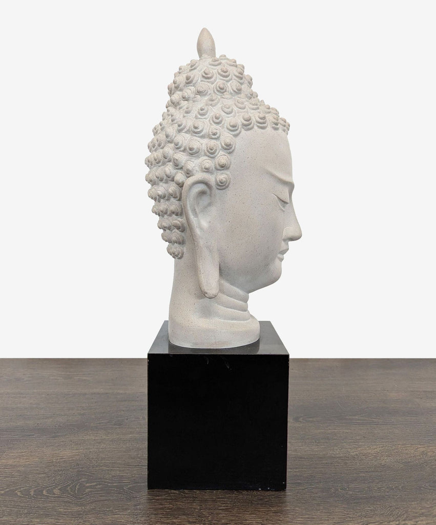 3. Elegant Buddha sculpture featuring a tranquil face, mounted on a black base, perfect for shelves or mantles.