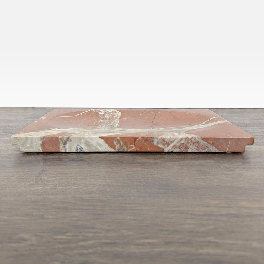 Oval-indented Rosa Marble board by Crate & Barrel, designed by Athena Calderone, hand-polished finish.