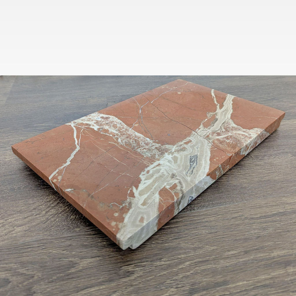 Hand-polished Rosa Marble board from Crate & Barrel, featuring an oval dip, designed by Athena Calderone.
