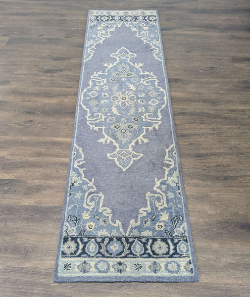 Pottery Barn blue and ivory runner rug with floral medallion, adding classic elegance to hallways.