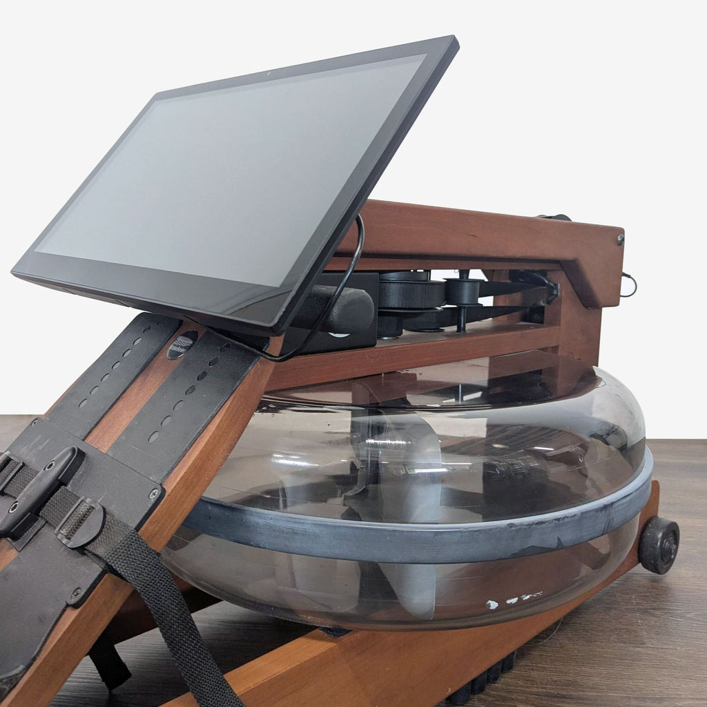 2. WaterRower rowing machine featuring real water resistance, adjustable footrests, and a sleek wood frame.