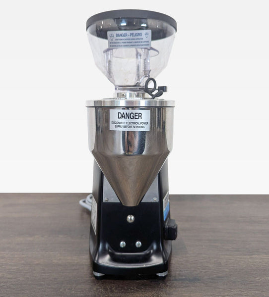 Mazzer coffee grinder with clear bean hopper, steel body, and simple controls for safe, precise grinding.