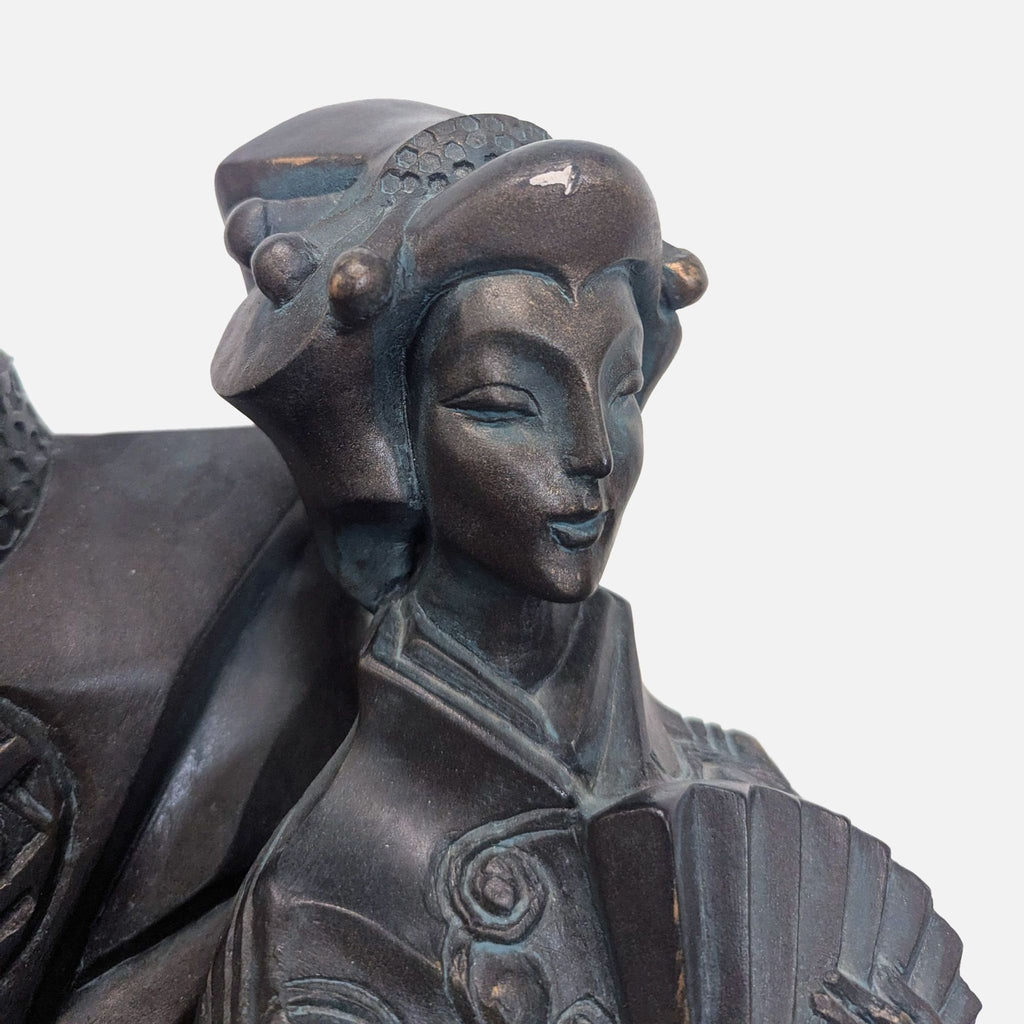 Decorative Japanese couple statue with fine craftsmanship and bronze-toned finish, ideal for cultural decor.