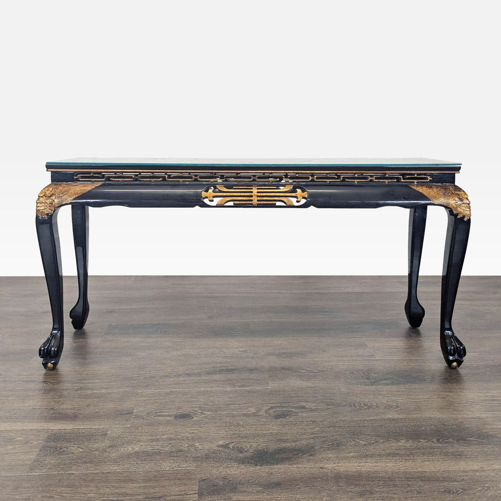 Hand-painted side table with gold accents, carved apron, cabriole legs, and glass top.
