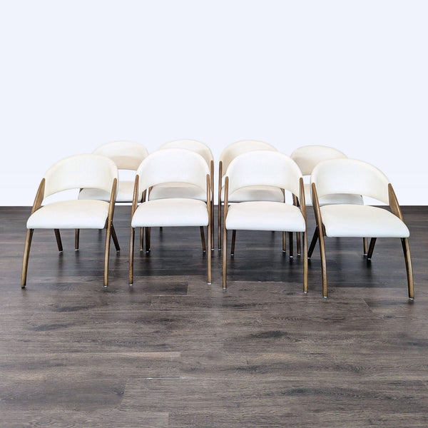 Mid-century dining chair with a walnut ash wood frame and cream vegan leather upholstery on seat and back.