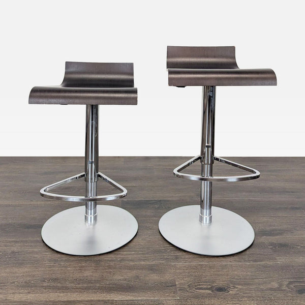 1. Pair of walnut-stained oak Ligne Roset Pam bar stools with chrome bases and hydraulic height adjustment.  