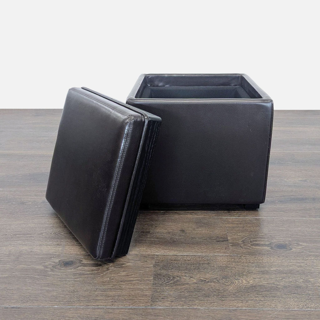 Crate & Barrel ottoman in bonded leather; flip the lid to reveal an ebony tray for serving or storage.