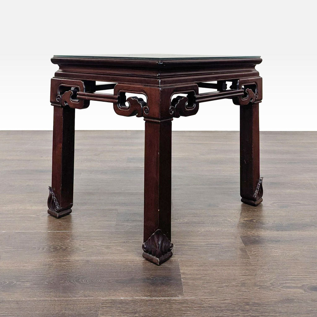 Rosewood console table in Ming style, topped with a clear protective glass panel.  