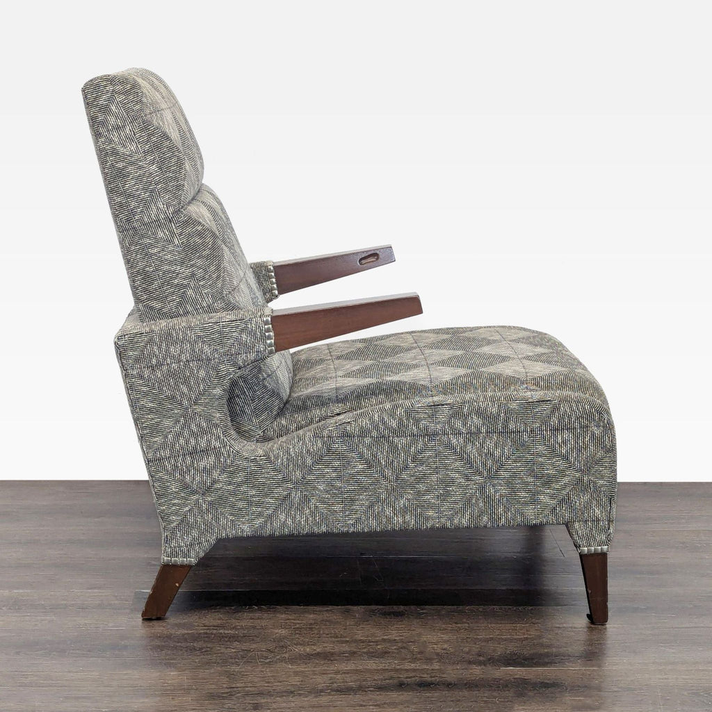 2. Side view of Ted Boerner Furniture lounge chair, showing thick cushioned seat and angled wooden arms.