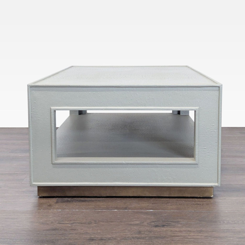 Wooden coffee table by Made Goods, featuring a faux ostrich texture.  