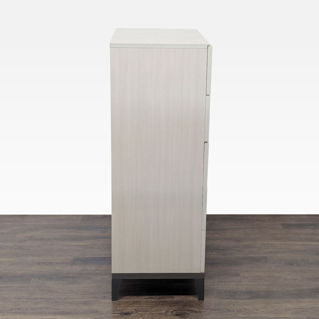 Profile shot of Alf + DaFre dresser, displaying its modern silhouette, light wood finish, and sturdy legs for durability.