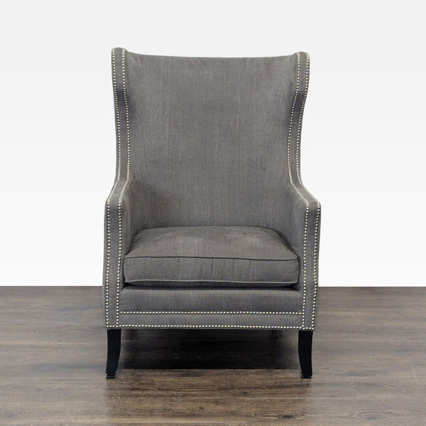 1. Front view of a Bernhardt lounge chair in gray with a high back, winged sides, and nailhead trim.  