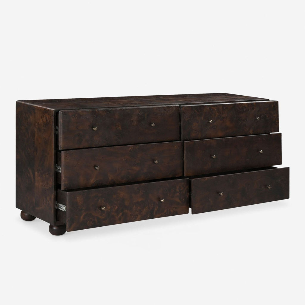 2. Angled view showing several open drawers of the Lulu and Georgia dark wood dresser for easy clothing storage.