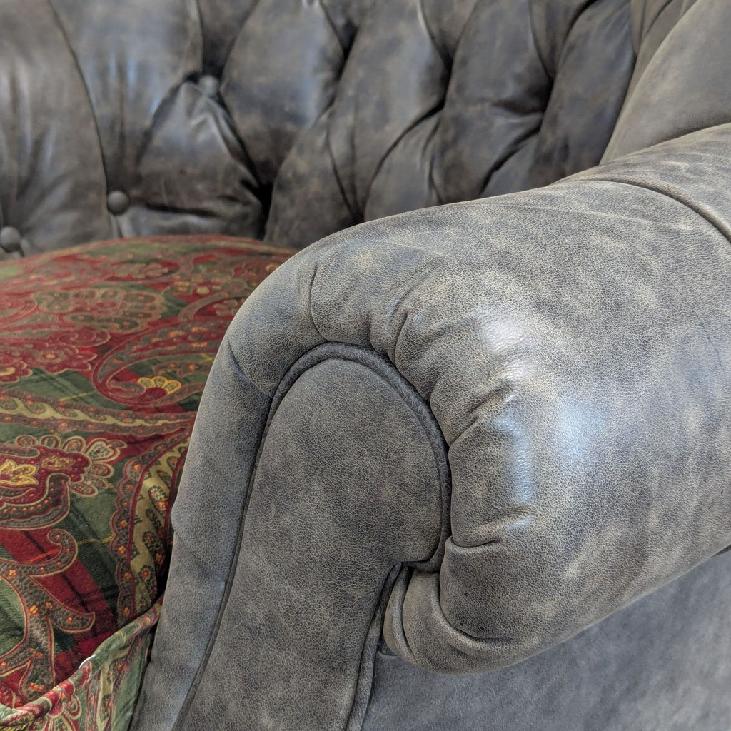 Stylish high-back chair with button tufting, rolled arms, patterned cushion, and mobile wooden legs by Lillian August.