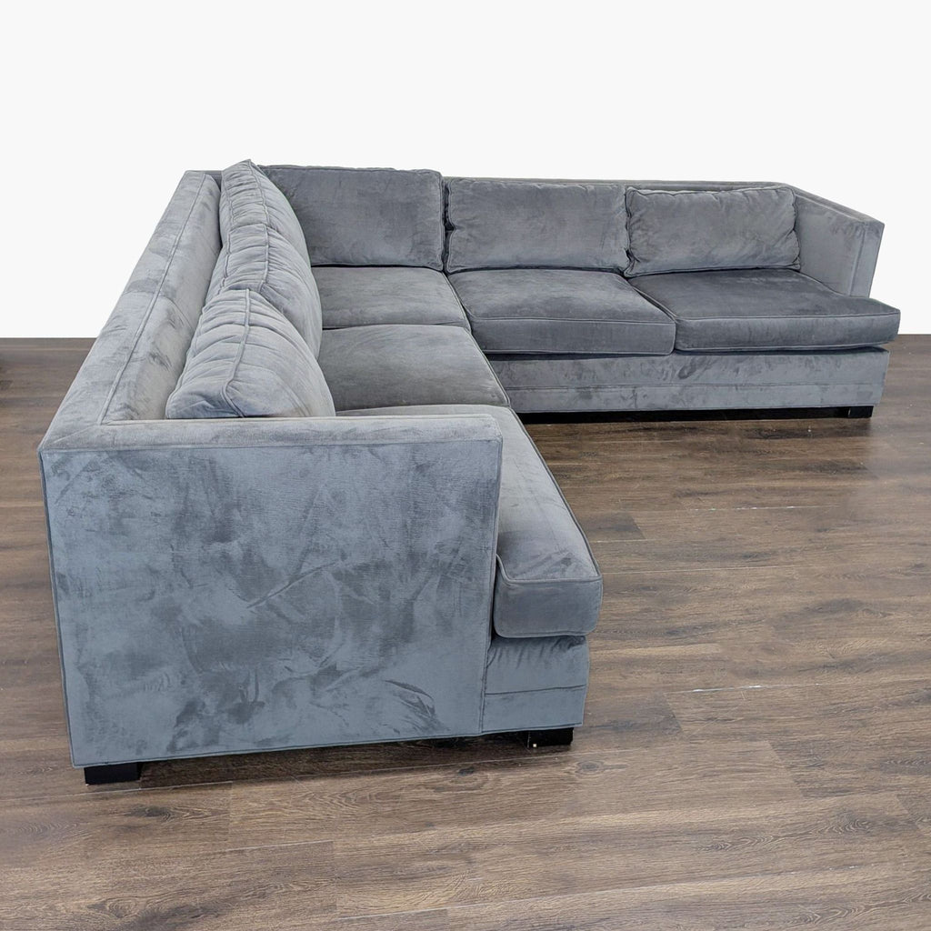 Modern gray velvet L-sectional sofa in great condition, offering spacious and comfortable seating.