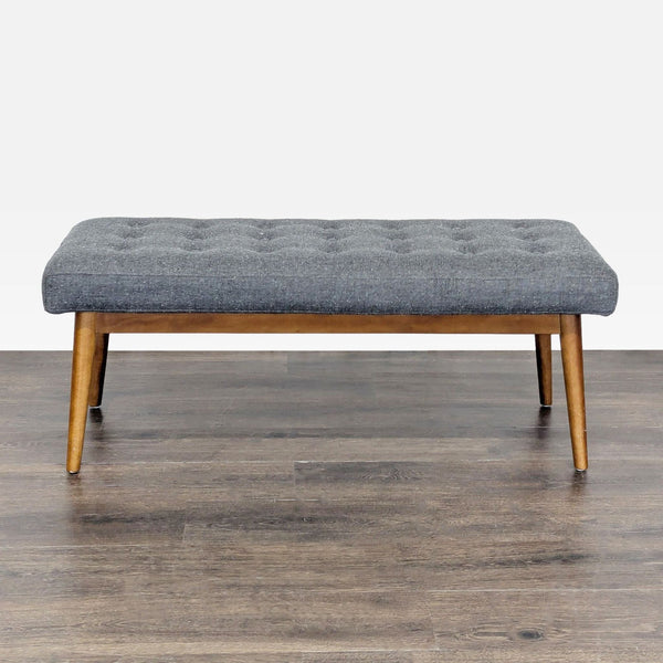 1. West Elm bench with gray tufted cushion and wooden legs, ideal for modern interiors, category Stools, Ottomans & Benches.