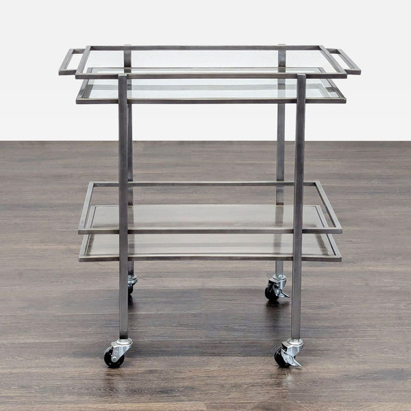 1. A metal and glass rolling cart with two shelves, viewed from the front on a wood floor.