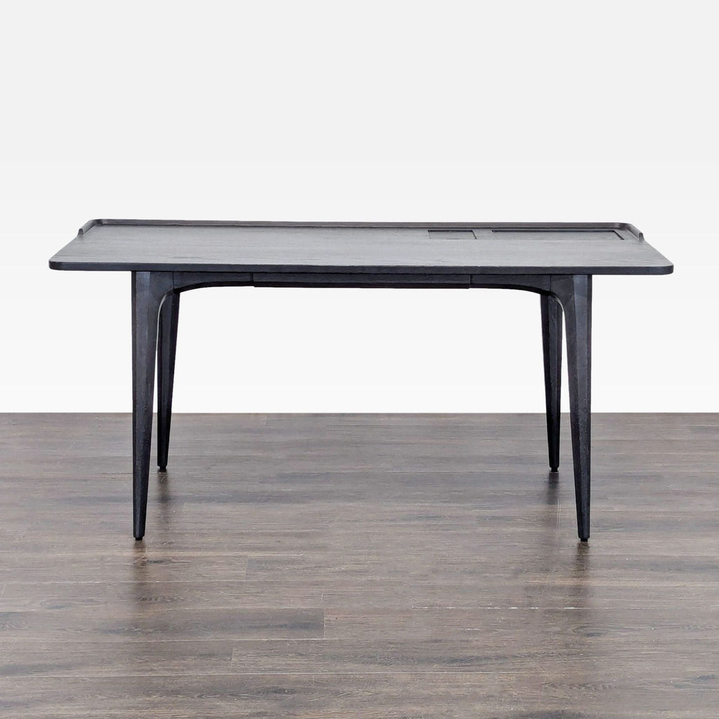1. Sleek black wood desk by District Eight with minimalist design, raised edge, and sturdy legs for stability.