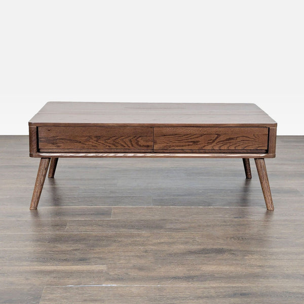 1. Mid-century modern coffee table with two drawers, dark wood finish, and angled legs on a wood floor.