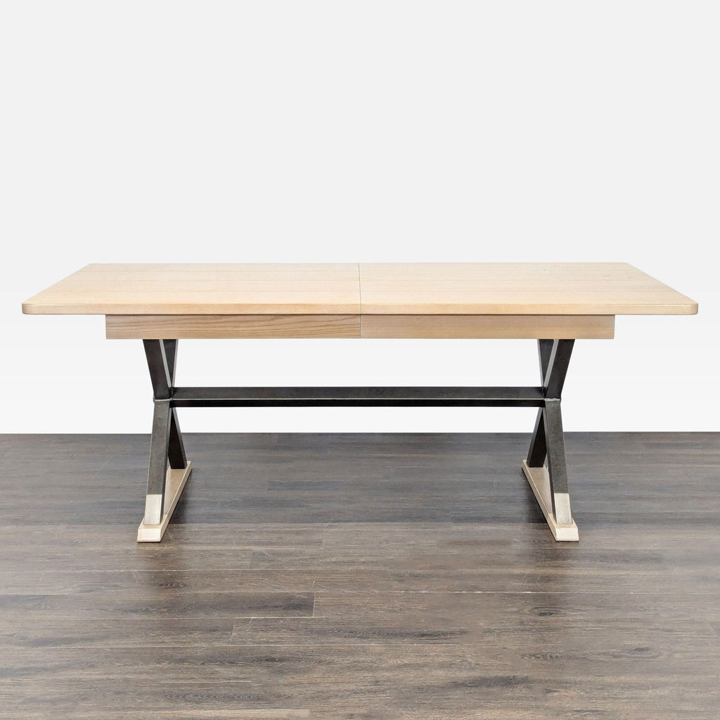 2. Modern dining table featuring a light wood plank top and sturdy metal and wood base, viewed from the front.  