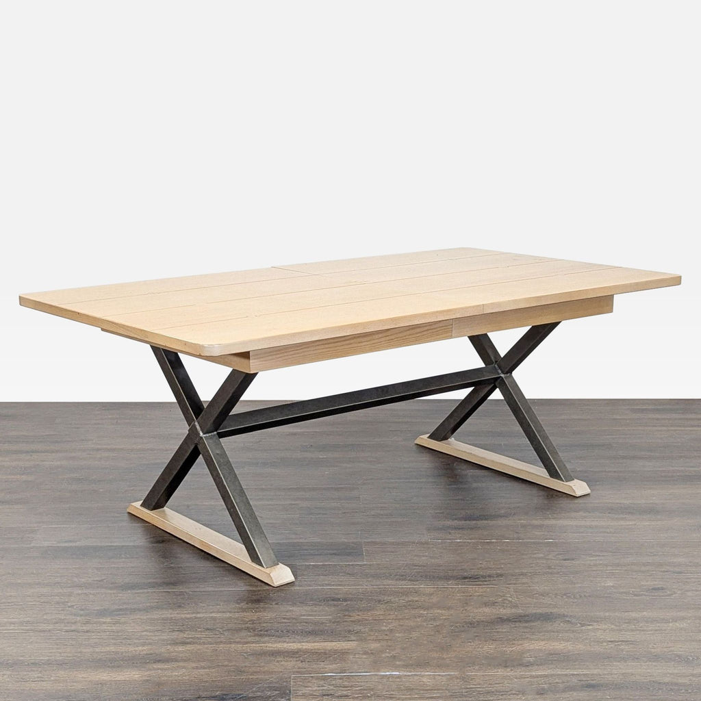 1. Rectangular dining table with a plank wood top and an X-shaped metal and wood base, shown on wood flooring.  