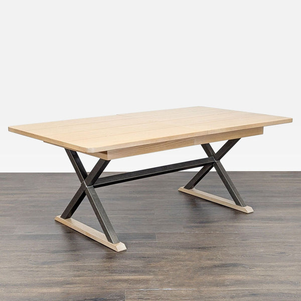 1. Rectangular dining table with a plank wood top and an X-shaped metal and wood base, shown on wood flooring.  
